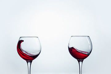 Image showing Two wine glasses against white