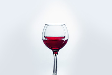 Image showing Two wine glasses against white