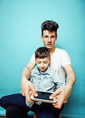 Image showing young pretty man model with little cute son playing together, lifestyle modern people concept, family male