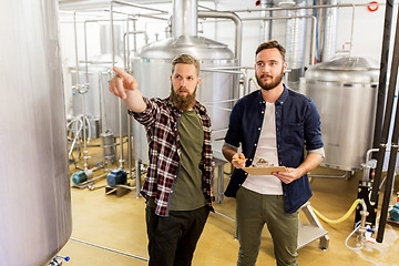 Image showing men with clipboard at craft brewery or beer plant