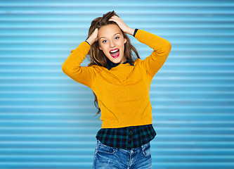 Image showing happy young woman or teen girl in casual clothes