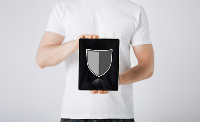 Image showing man with antivirus program icon on tablet pc