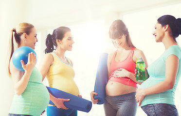 Image showing group of happy pregnant women talking in gym