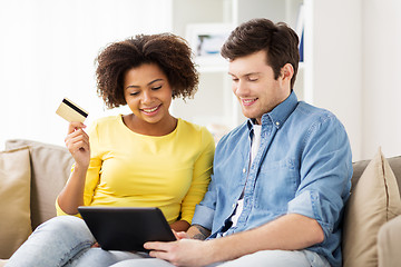 Image showing couple with tablet pc and credit card at home