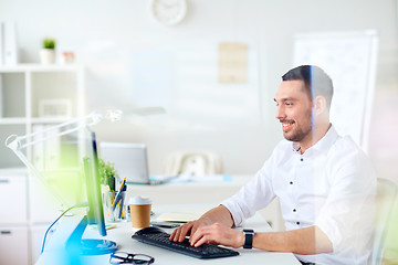 Image showing businessman typing on computer keyboard at office