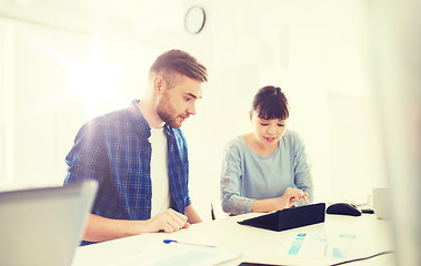 Image showing creative team with tablet pc and papers at office