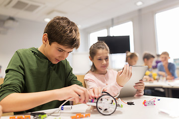 Image showing kids with tablet pc programming at robotics school