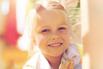 Image showing happy little girl climbing on children playground