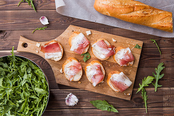 Image showing Baguette , bacon on cutting board