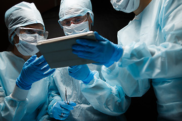 Image showing Doctors with computer in hands