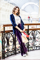 Image showing smiling woman in a large shopping center