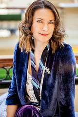 Image showing woman in purple jacket with dragonfly brooch