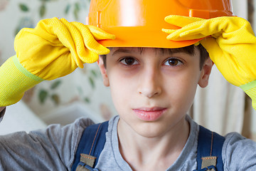 Image showing boy in a construction helmet