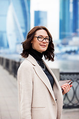 Image showing fashion style. portrait of a beautiful businesswoman in a light 