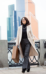 Image showing Beautiful businesswoman in a light coat