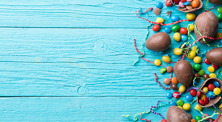 Image showing Chocolate eggs, jelly beans, ribbons