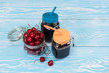 Image showing Cherry juice with glass of berries