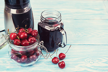 Image showing Cherry juice with glass of berries