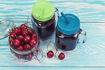 Image showing Cherry juice with glass of berries