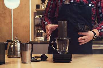 Image showing Barista brewing aeropress coffee