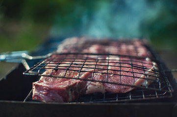 Image showing Grilling fresh entrecote pork