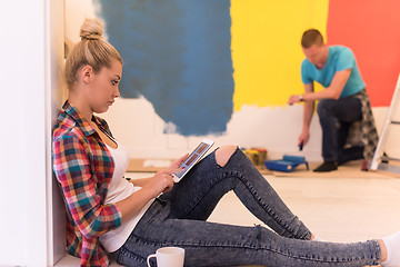 Image showing couple doing home renovations