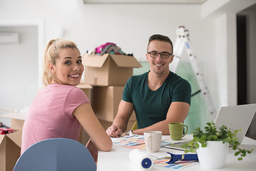 Image showing Young couple moving in a new home