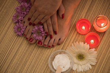 Image showing female feet and hands at spa salon