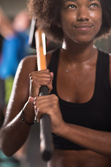 Image showing black woman after workout with hammer