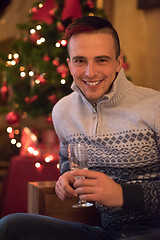 Image showing Happy young man with a glass of champagne