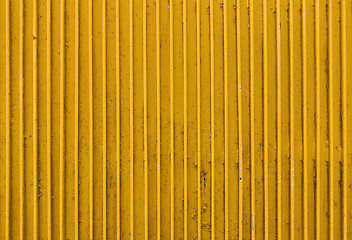 Image showing old yellow painted metal ribbed surface