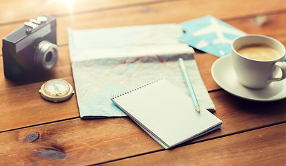 Image showing close up of notepad with map and travel tickets