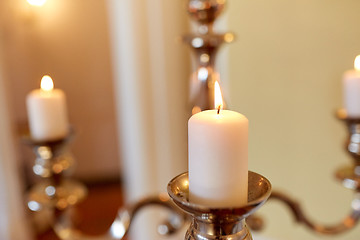 Image showing candles burning in church