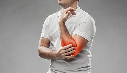 Image showing close up of man suffering from pain in hand