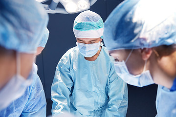 Image showing group of surgeons in operating room at hospital