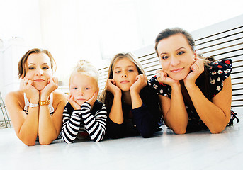 Image showing Mature sisters twins at home with little daughter, happy family 