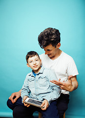 Image showing young pretty man model with little cute son playing together, lifestyle modern people concept, family male