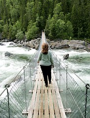 Image showing Woman on suspension bridge