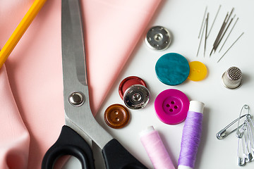 Image showing scissors, sewing tools and cloth