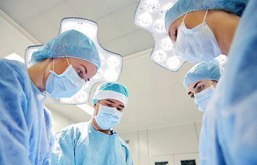 Image showing group of surgeons in operating room at hospital