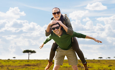 Image showing smiling couple with backpacks traveling in africa