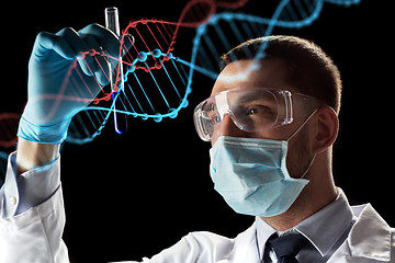 Image showing scientist with test tube and dna molecule