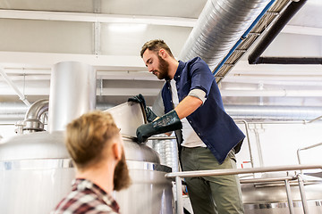 Image showing men working at craft brewery or beer plant