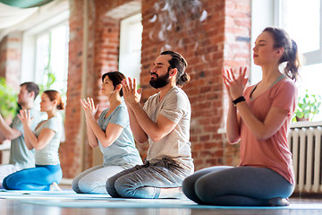 Image showing group of people meditating at yoga studio