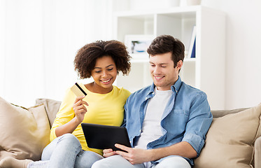 Image showing couple with tablet pc and credit card at home