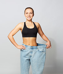 Image showing young slim sporty woman in oversize pants