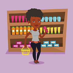 Image showing Customer with shopping basket and tube of cream.