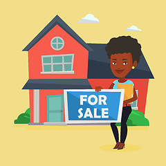 Image showing Young female realtor offering house.