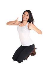 Image showing Woman kneeling with thumps up.