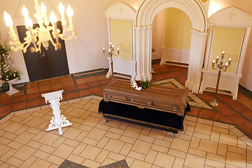 Image showing coffin with flowers and stand at funeral in church